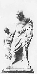 An ancient Greek statue of the slave Pedagogue (Wikipedia)